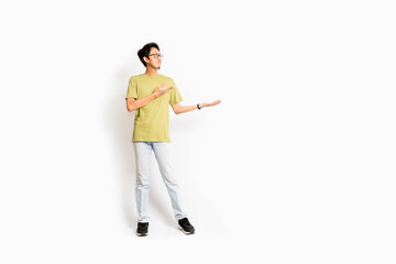 Single skinny young male. The full body of an Asian or Indonesian person. Isolated photo studio with white background.