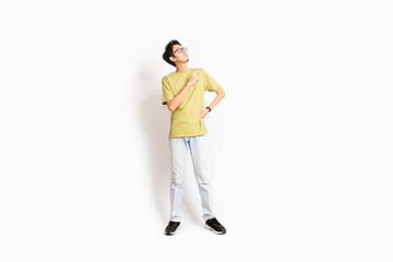 Single skinny young male. The full body of an Asian or Indonesian person. Isolated photo studio with white background.