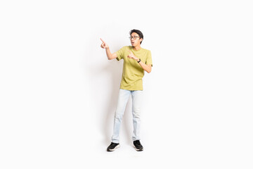 Single skinny young male. The full body of an Asian or Indonesian person. Isolated photo studio with white background.