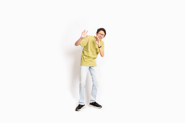 Single skinny young male. The full body of an Asian or Indonesian person. Isolated photo studio with white background.