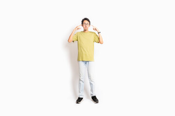 Fototapeta premium Single skinny young male. The full body of an Asian or Indonesian person. Isolated photo studio with white background.