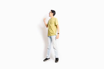 Single skinny young male. The full body of an Asian or Indonesian person. Isolated photo studio with white background.