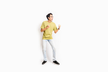 Single skinny young male. The full body of an Asian or Indonesian person. Isolated photo studio with white background.