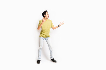 Single skinny young male. The full body of an Asian or Indonesian person. Isolated photo studio with white background.