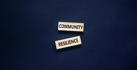 Community resilience symbol. Concept word Community resilience typed on wooden blocks. Beautiful black table black background. Business and community resilience concept. Copy space.