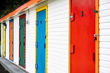 Colourful doors along a boat shed building near the harbour in Dildo Newfoundland Canada.