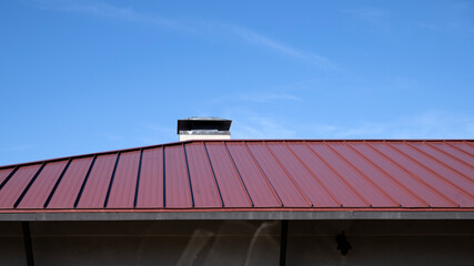 A building metal red roof