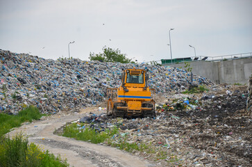 Crawler dozer working in landfill.