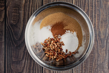 Dry Ingredients for Pumpkin Spice Streusel Topping: Sugar, pecans, and other ingredients in a mixing bowl viewed from above