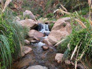 River and a small waterfall among the rocks in the Rio Colorado Gorge near the Argentine town of Cafayate