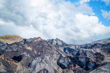Icy glacier mountains covered in dirt