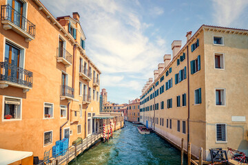 Fototapeta na wymiar River canal in Venice Italy with balconys and windows