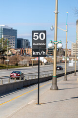 Fototapeta premium Speed limit road sign in the street, 50 km per hour maximum in Ottawa city, Canada.