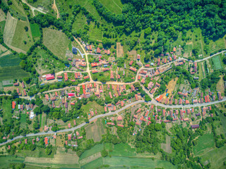 Aerial drone view of rural village. Village or countryside with horse stables and barns.