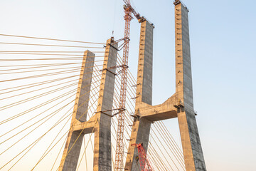 Cortalim, Goa - India - Dec 22nd 2022: New Zuari Bridge will be inaugurated on 29th December 2022 by Mr. Nitin Gadkari. Twin 4 Lane Zuari Bridge undertaken by Dilip Buildcon Ltd. - obrazy, fototapety, plakaty