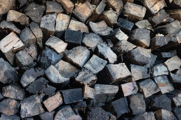 Stack of firewood. Pile of wooden beams.