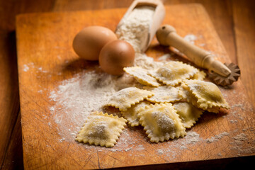 italian ravioli with ingredient over cutting board
