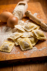 italian ravioli with ingredient over cutting board
