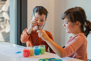 Kids creating environmental placards together