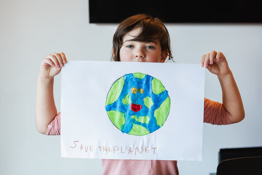 Girl showing handmade environmental poster