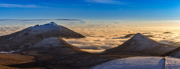 Fototapeta na wymiar Cloud Inversion in the Silent Valley around Doan and Slieve Binnian, from Slieve Meelmore at sunset, Mourne Mountains, County Down, Northern Ireland