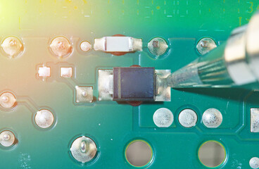 soldering of electronic components on a printed circuit board with an electric soldering iron
