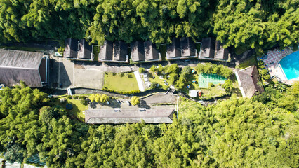 Fototapeta premium Aerial view of The Plot of land with house and swimming Pool Aerial Shot Top View. Lake Side Villa Puncak. 