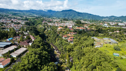 Fototapeta na wymiar Aerial view of The Beautiful scenery on top of hill Puncak Bogor. 