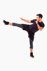 HIIT workout. Male fitness instructor working out. White background photoshoot.