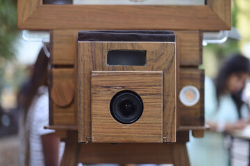 Photomaton with wooden box close up at social event
