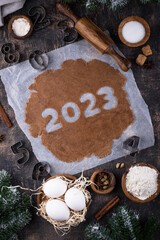 Gingerbread dough for cookies in shape of 2023