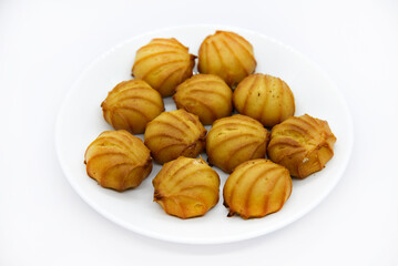 Delicious custard cake with cream on a white plate. Delicious sweet breakfast.