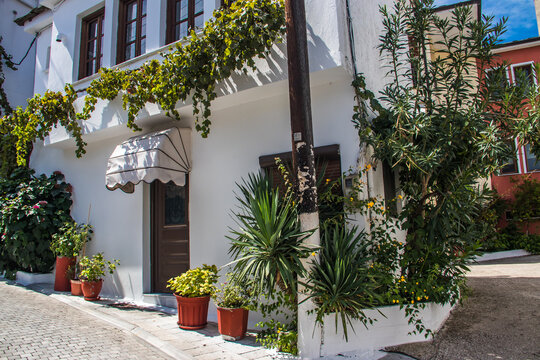 Typical narrow Greek streets and architecture with country side houses style in small village named Potamia at Thasos island, South-East from Thessaloniki 