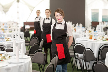 waitresses standing in the Banquet hall of the restaurant - 555727510