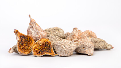 dry dried figs and seeds on white background
