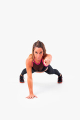 Fototapeta premium Mid age woman working out. Female fitness instructor exercising and working out HIIT. Strong woman working out. Fitness lifestyle.