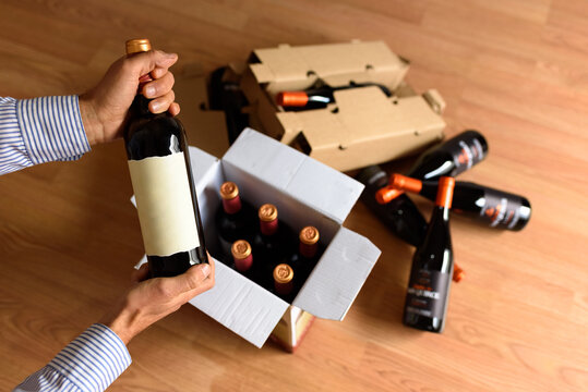 Cardboard box with quality wine bottles sent by post
