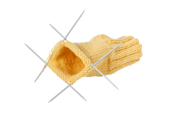 Knitting a sock. Part of a sock with knitting needles on a white background.