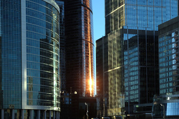 Fototapeta na wymiar Dense standing buildings of business area in Moscow City International Business Centre skyscrapers on sunset front view close up