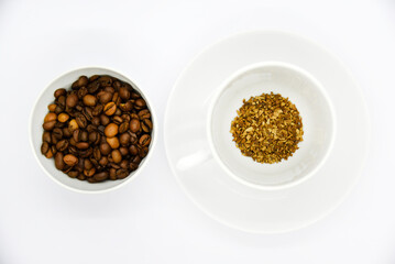 Toasted coffee beans in a porcelain cup. Coffee mixture. Delicious coffee beans and freeze-dried.