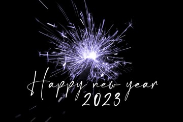 Happy new year 2023 purple sparkler new years eve countdown. Luxury entertainment celebration turn of the year party time. Premium nightlife visual with glowing light sparks on dark background - 555735916