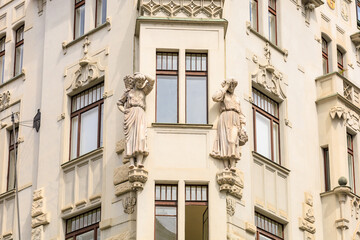 Corner of the house of classical European architecture of the old cozy tourist city. Background with selective focus