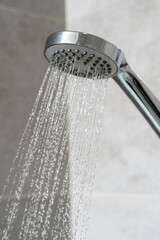 water pours from the shower head. shower-bath. Close up 