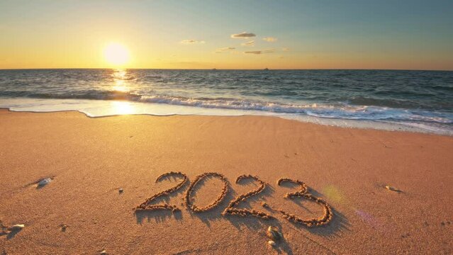 2023 year on the sea shore during the sunset.	
