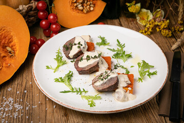 a pumpkin dish prepared by a chef in a restaurant
