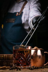 the cocktail is prepared by the bartender in the restaurant
