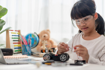 Asia students learn at home in coding robot cars and electronic board cables in STEM, STEAM,...