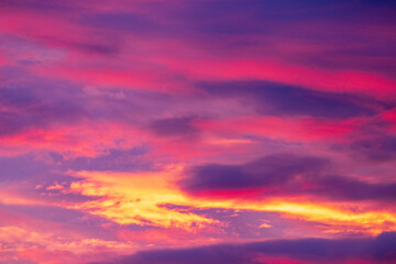 Naklejka na ściany i meble clouds in the sky over sunset