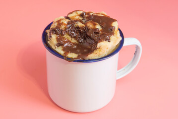 Mug cake with chocolate close up