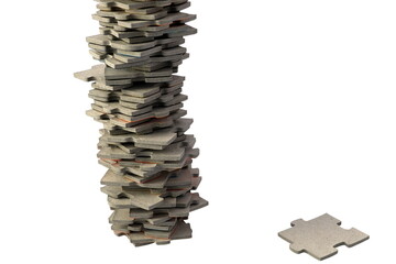 One large and one small pile of puzzle pieces. Concept of working hard or not. Close up and isolated on a white background. Sweden, 2022.